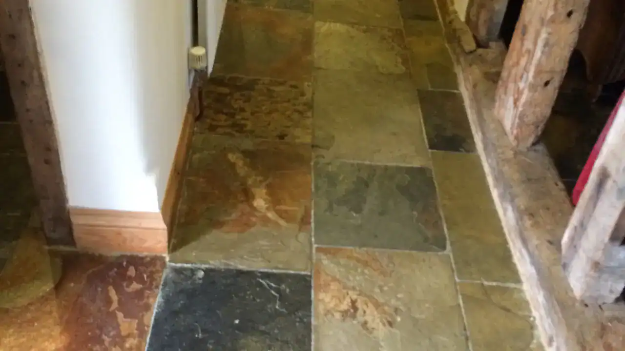 Slate floor after clear wax finish with richer colour and soft sheen