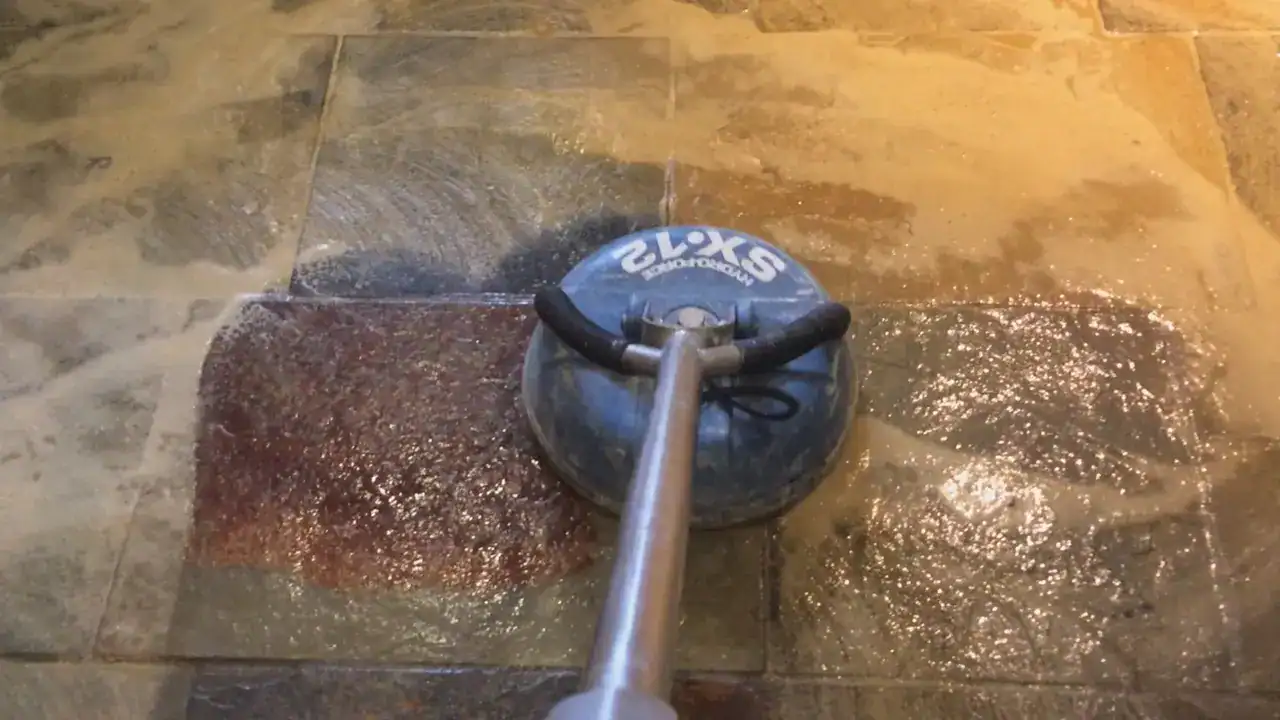 Gentle pressure rinsing removes emulsified soil from slate clefts and grout