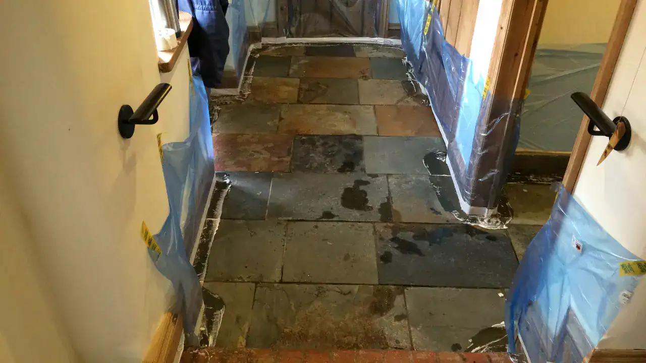 Solvent treatment applied to heavy wax build-up on a slate floor