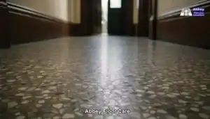 Close-up view of a traditional Glasgow terrazzo hallway floor in natural daylight.