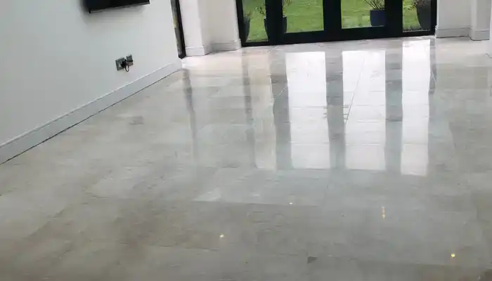 Marble floor showing a clear reflection after polishing, in a UK living room with natural light