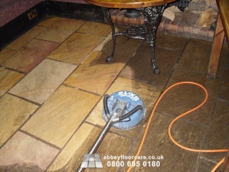 pressurised rinsing sandstone floor to remove emulsified soil