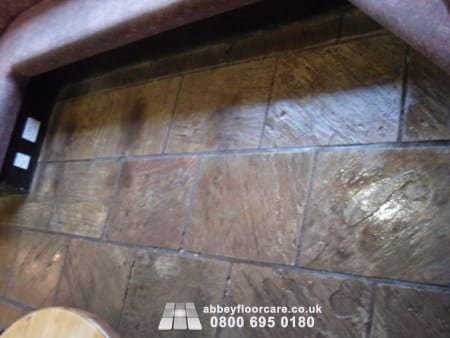 letting a heavy duty sandstone cleaning chemical emulsify ingrained soil