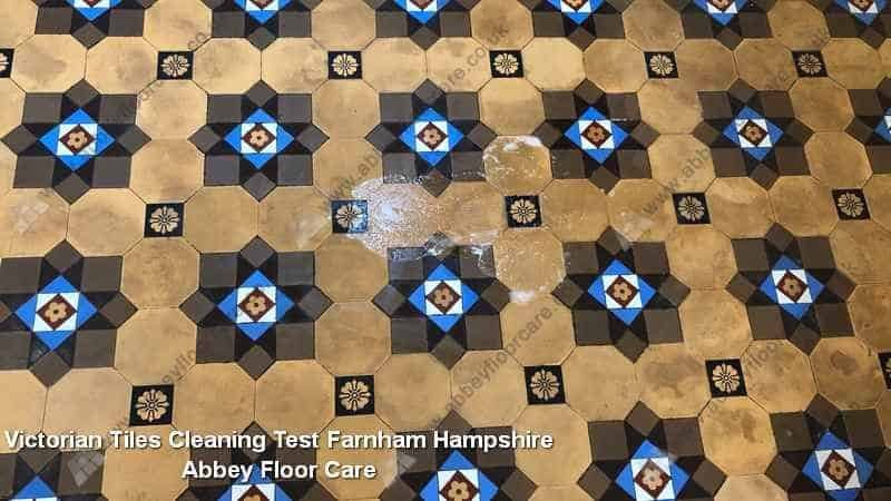 Small test patch on a Victorian tiled floor in Farnham showing the contrast between soiled and cleaned areas
