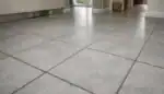 Ceramic and porcelain tile floor showing clean tiles with darker grout lines in a UK home