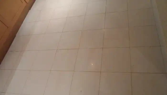 Even, natural limestone floor in a UK home after surface correction and stabilisation