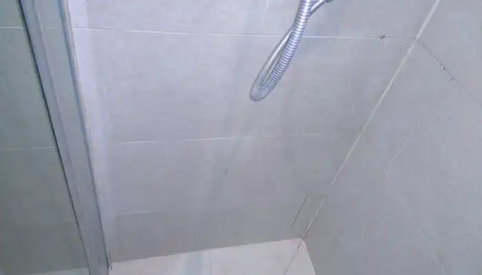 Sealed limestone shower surface with even natural finish