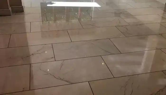Clean marble floor in a lived-in home showing natural light and everyday wear