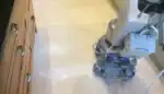 Marble floor undergoing restoration to correct uneven tiles and surface damage