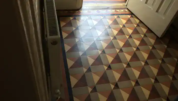 Restored Minton tile floor with renewed colour and finish in Tutbury