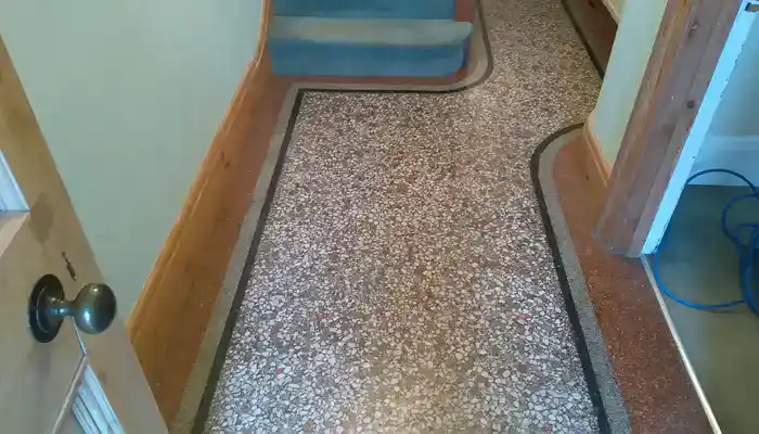 Close-up of restored terrazzo floor with consistent satin finish