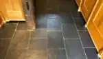 Natural slate floor in a UK home showing variation in colour and wear from everyday use.