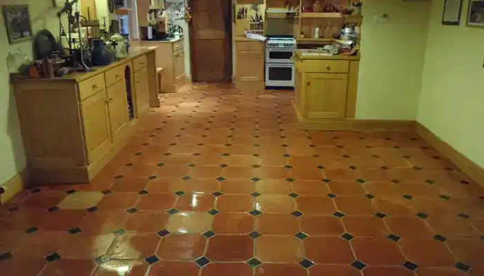 Restored terracotta floor in a UK home after professional cleaning and sealing