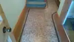 Restored terrazzo floor in a UK home hallway with an even satin finish