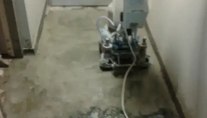 Mechanical grinding of terrazzo floor using metal-bond diamond abrasives.