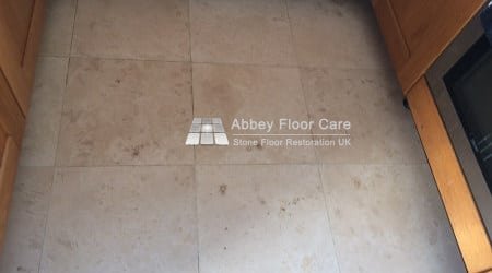 travertine tiles in balderton newark with holes filled with soil