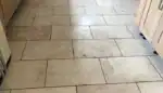 Travertine flooring in a real home showing natural colour variation and surface texture