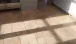 Cleaned and sealed tumbled travertine floor in a Moreton-in-Marsh home after professional work was completed