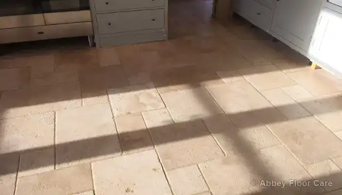 Discover How Our Tumbled Travertine Cleaning Service Saved This Soiled Floor