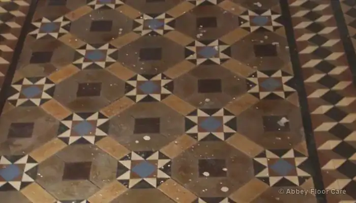 Victorian clay tile hallway floor in Blyth showing paint marks and old sealer residues before restoration