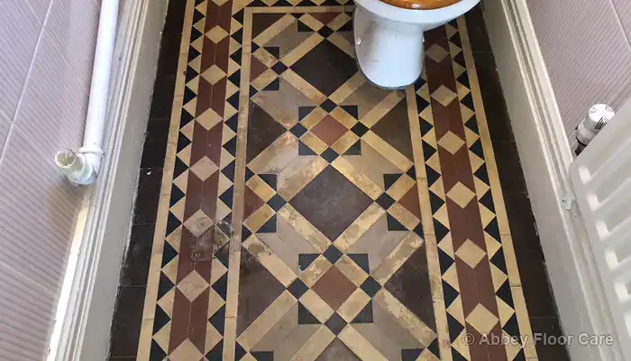 Efflorescence damage on Victorian clay tile floor surface